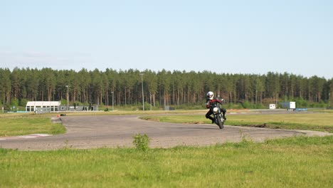 Wider-radius-cornering-on-a-roadster-racetrack-motorcycle