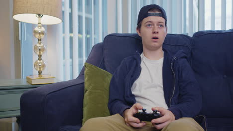 Young-man-flinches-while-playing-video-games-and-is-then-disappointed