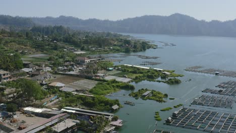 aerial-of-a-seaweed-farm-in-batur-lake-around-bali-indonesia-during-day