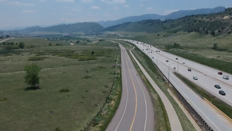 A-drone-shot-of-a-busy-highway-and-bike-path