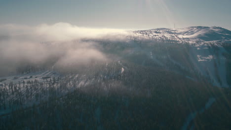 Stunning-cinematic-drone-shot-of-a-frozen-mountain-early-in-the-morning