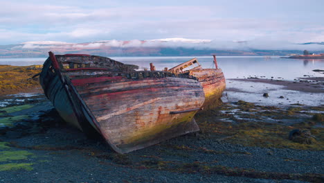 Stunning-cinematic-tracking-shot-of-rotting-wooden-boats