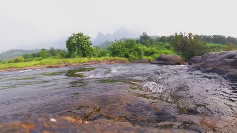 Regular-speed-time-lapse-of-a-small-flowing-river-in-India