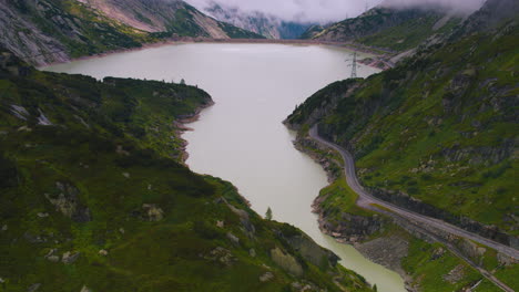 Cinematic-tilt-up-aerial-shot-of-a-reservoir-in-Switzerland