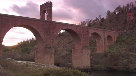 Cinematic-tracking-shot-of-Alcántara-Bridge-at-golden-hour