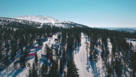 Cinematic-aerial-shot-over-skiers-on-a-drag-lift