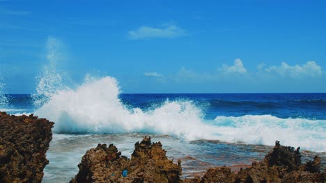Ocean-waves-crashing,-spraying-high-into-air,-Curacao-coast,-Caribbean,-SLOWMO