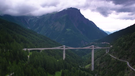 Stunning-cinematic-aerial-wide-shot-of-Ganter-Bridge-in-Switzerland