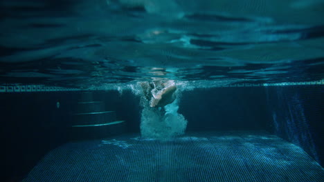 A-man-in-his-thirties-swims-front-crawl-towards-camera