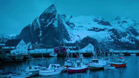 Cinematic-close-shot-of-fishing-boats-in-Hamnoy,-Lofoten-at-dusk
