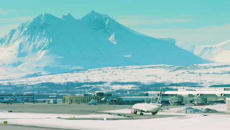 A-passenger-plane-arrives-at-Tromso-airport,-Norway,-in-winter