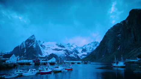 Cinematic-wide-shot-of-fishing-boats-in-Hamnoy,-Lofoten-at-dusk