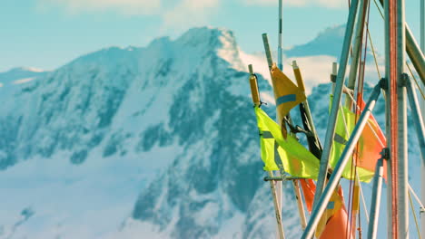Fishing-flags-with-snowy-mountains-behind
