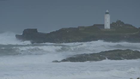 Stunning-cinematic-close-up-shot-of-a-stormy-sea-around-a-lighthouse