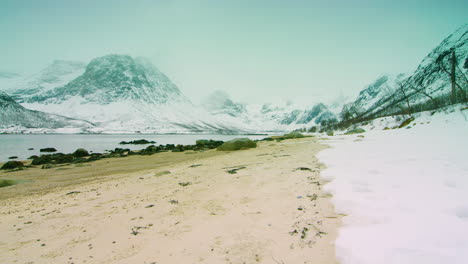 Stunning-cinematic-tracking-shot-right-to-Left-of-a-frozen-Norwegian-beach