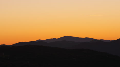 Golden-dawn-shot-of-a-plane-over-the-Pyrenees