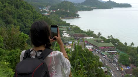 Female-at-Watchpoint,-taking-a-picture-at-Koh-Chang,-Thailand