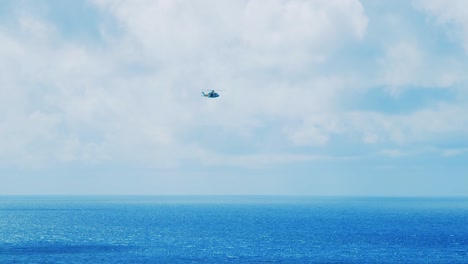 Curacao-Coastguard-helicopter-flying-across-the-ocean-on-a-clear-and-sunny-day-in-Curacao