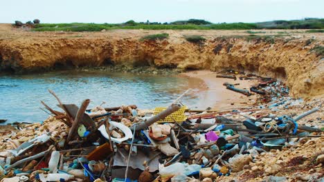 Trash-piled-up-on-tropical-Caribbean-beach-alcove