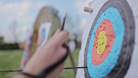 Archer-pull-out-arrows-from-bullseye