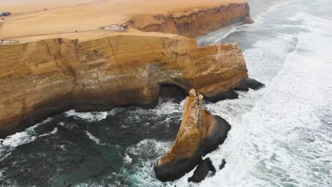 Orbital-shot-of-tourist-view-point-at-the-edge-of-the-cliff-in-the-Paracas-National-Park