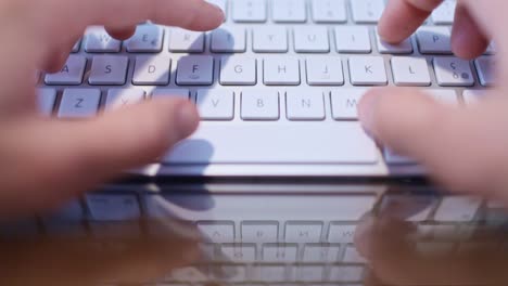 Male-Office-Worker-Typing-on-Keyboard