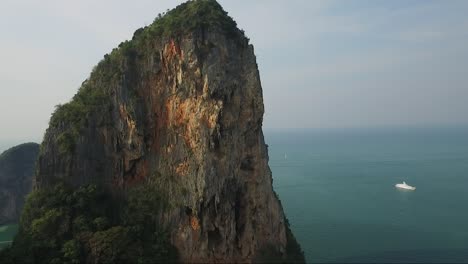 Marvelous-rising-aerial-shot-over-a-limestone-cliff-in-the-tropical-island-of-Krabi