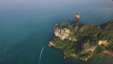 Dazzling-overhead-aerial-shot-of-limestone-cliffs-on-a-secluded-tropical-island