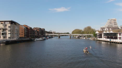 People-kayaking-near-Kingston-Upon-Thames-river,-aerial-low-altitude-view