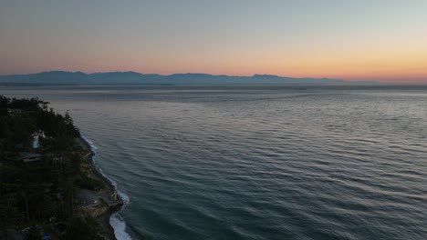 Aerial-view-from-Whidbey-Island-looking-over-at-the-Olympic-Mountains-during-sunset