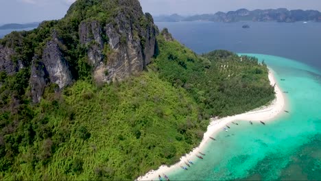 Awesome-drone-shot-over-a-green-mountainous-tropical-island
