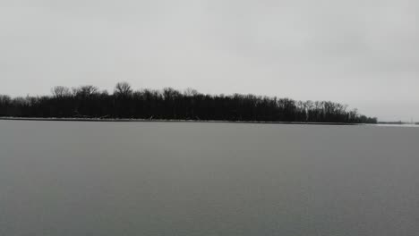 A-low-fly-over-towards-a-small-island-of-partially-frozen-Creve-Coeur-Lake