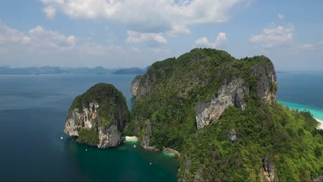 Beautiful-drone-shot-of-limestone-cliffs-on-an-island-in-Thailand