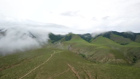 Aerial-view-above-El-Mollar-green-mountain-range,-Dique-la-Angostura