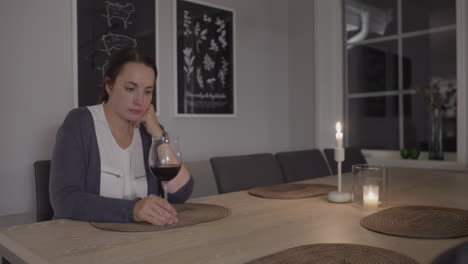 Sad-pensive-woman-drinks-wine-alone-at-home,-4k