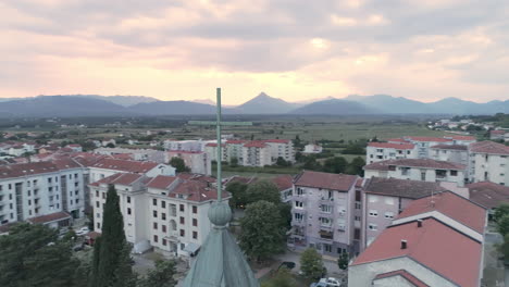 Drone-footage-of-the-top-of-the-local-catholic-church-in-Ljubuski,-Bosnia-and-Herzegovina