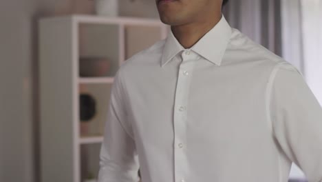 Buttoning-Sleeves-of-White-Shirt,-Young-Asian-Businessman,-Clean-Look