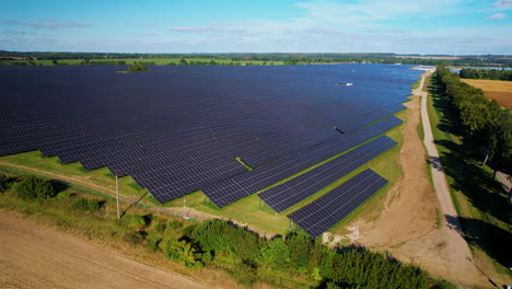 Aerial-shot-above-Solar-Panels-Farm-Field-Of-Green-Renewable-Energy