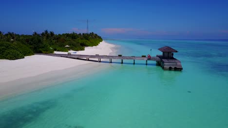 Beautiful-Fulidhoo-Island,-calm-aqua-waters-at-empty-beach-in-the-Maldives