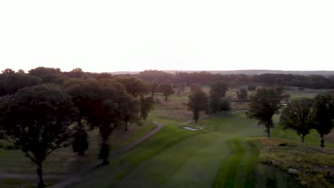 Flying-Through-Golf-Course-at-Sunset