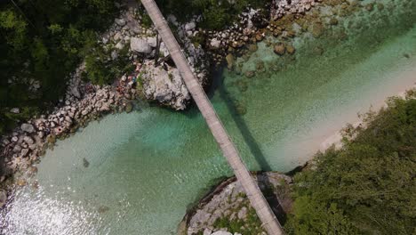 A-beautiful-drone-shot-of-the-Soča-River-with-a-bridge