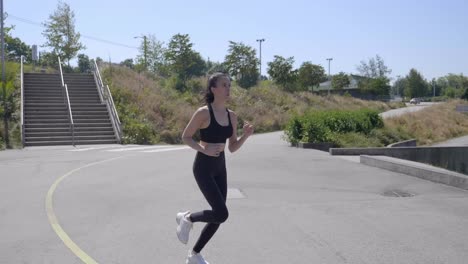 Attractive-Sportive-Girl-Running-Outside-in-the-Sun,-Slow-Motion