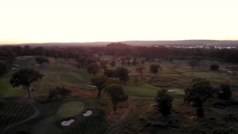 Aerial-View-of-Golf-Course-at-Sunset