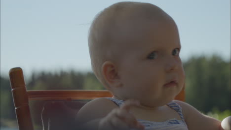 Portrait-of-Cute-baby-face-reacting-to-sound-outdoors