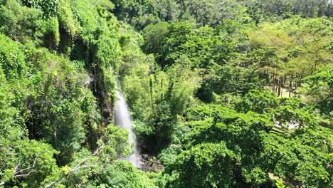 Aerial-view-of-a-large-waterfall-in-the-rain-forest-of-Reunion-Island,-A-french-island-in-the-Indian-Ocean