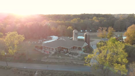 Aerial-View-of-Farm-Building-at-Sunset