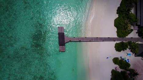 Birds-eye-view-over-resort-gangway-and-shimmering-turquoise-waters-in-Seychelles