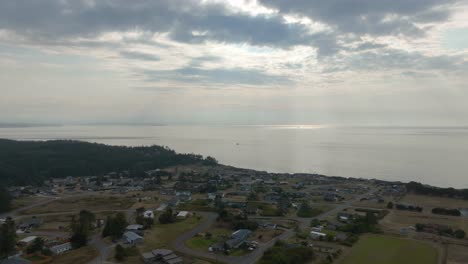 Aerial-time-lapse-of-the-Sierra-Country-Club-community-on-Whidbey-Island-with-sun-peaking-through-the-shifting-clouds
