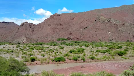 Beautiful-mountainscape-and-a-river-in-Cafayate-Valley-at-Route-68-on-a-sunny-day