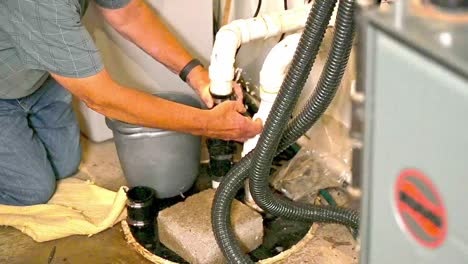 Slow-motion-septic-sewer-sump-pump-repair-with-a-repairman